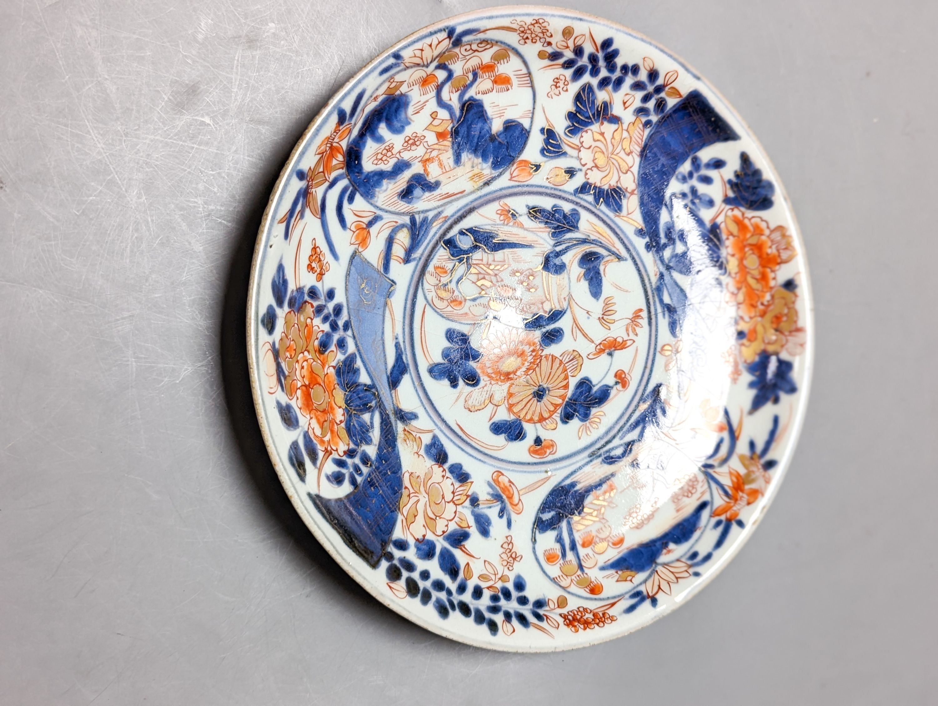 A 19th century Chinese porcelain bowl, transfer printed pillow, a Japanese Imari jar and cover and three Imari plates 21cm